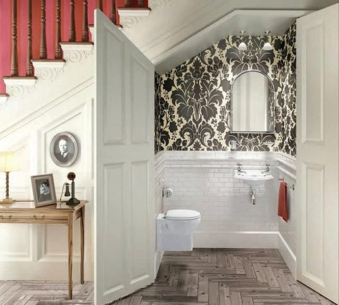 Post_traditional powder room with wallpaper tankless toilet and bathroom mirror i_g is pn3ieankvof1 kvx5a.jpg