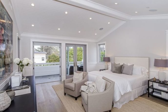 Post_transitional master bedroom with cathedral ceiling crown molding and wainscoting i_g isdc225gm9knx20000000000 gxdcq.jpg