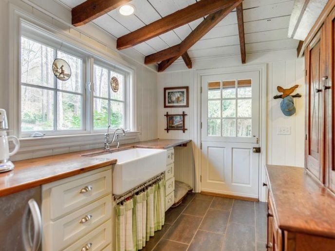 Post_country kitchen with exposed beams white cabinets and dutch door i_g istkn0mopt2z110000000000 xjzzx.jpg