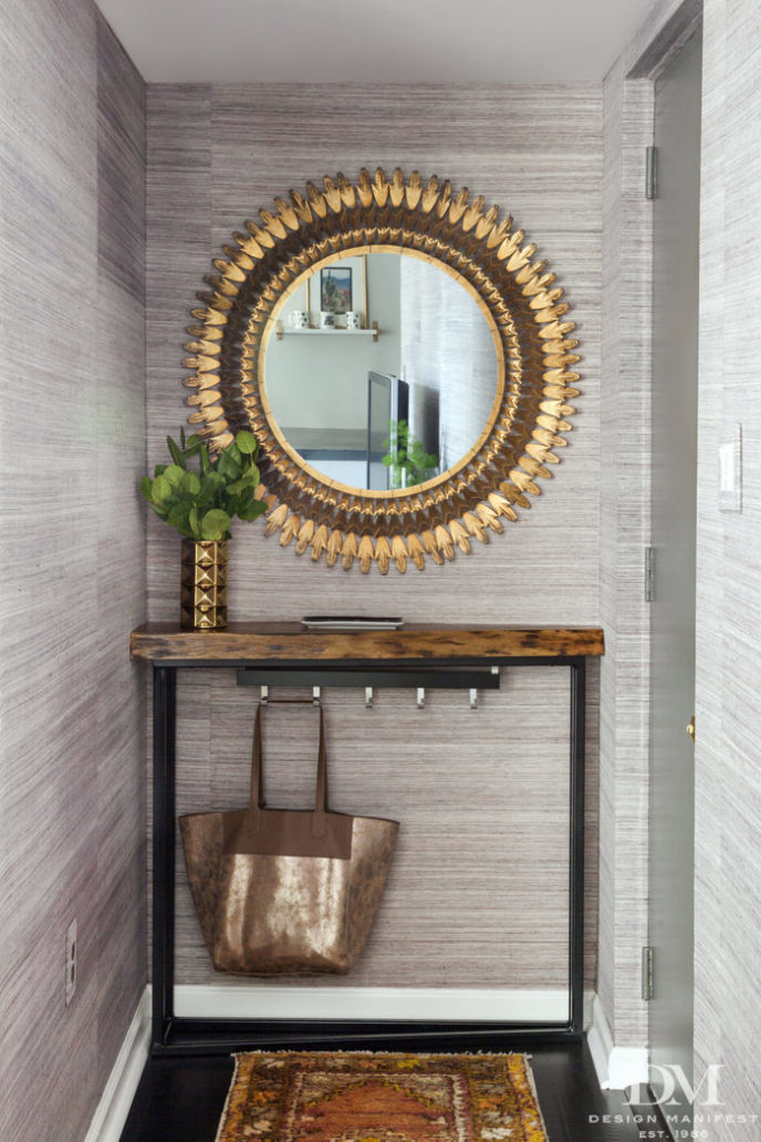 Post_condo entry with gray grasscloth gold sunburst mirror walnut live edge shelf and turkish rug petite entry 973x1460.jpg