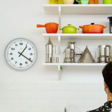 Post_open shelves in the kitchen create an airy ambiance and double as lovely display in the small space.jpg