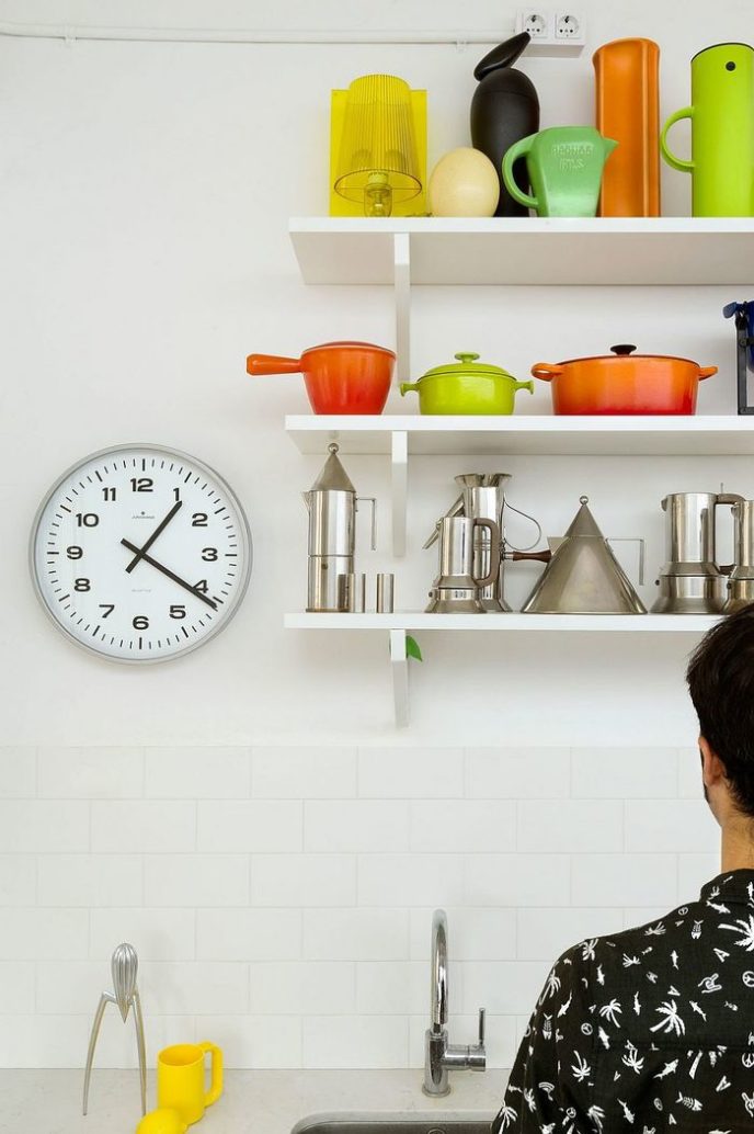 Post_open shelves in the kitchen create an airy ambiance and double as lovely display in the small space.jpg