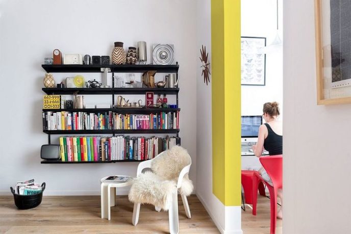 Post_sleek bookshelf with floating shelves that save space.jpg