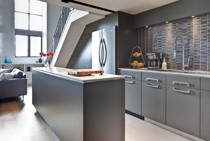 Post_modern understair kitchen design with grey cabinets and kitchen island finish granite countertop.jpg