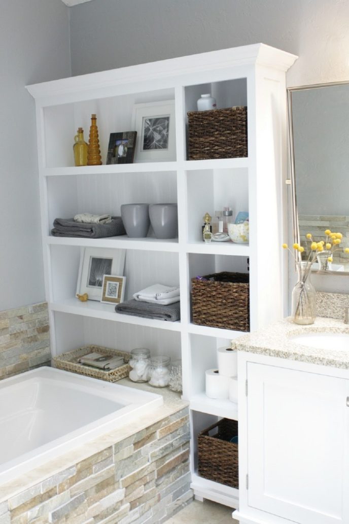 Post_white wooden bathroom shelf over bathtub with rattan wicker storage basket plus white vanity cabinet with sink.jpg