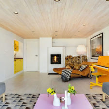 Post_contemporary scandinavian living room with orange piano yellow cabinets and triangle patterned rug.jpg