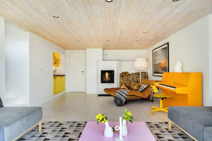 Post_contemporary scandinavian living room with orange piano yellow cabinets and triangle patterned rug.jpg