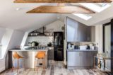 Attic kitchen with skylights and tiled backsplash.jpg