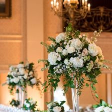 Greenery and white tall wedding centerpiece.jpg