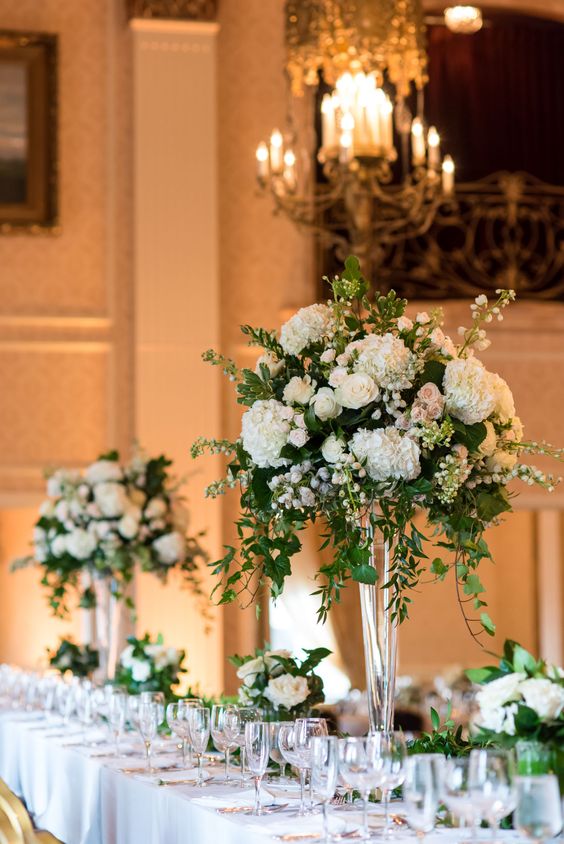 Greenery and white tall wedding centerpiece.jpg