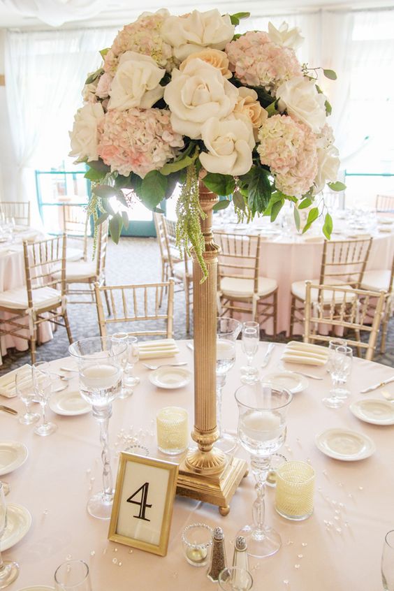 Ivory and cream tall wedding centerpiece.jpg