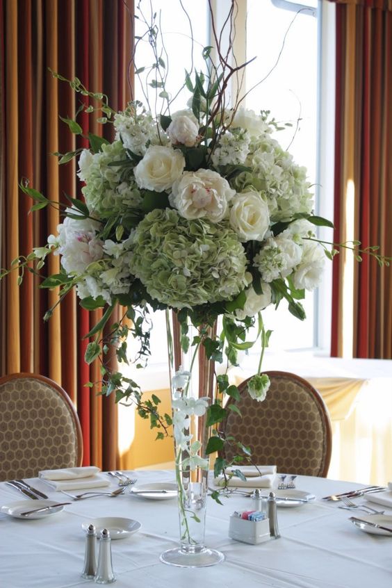 White and greenery tall wedding centerpiece.jpg