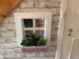 Holly happy with her under stairs playground.jpg