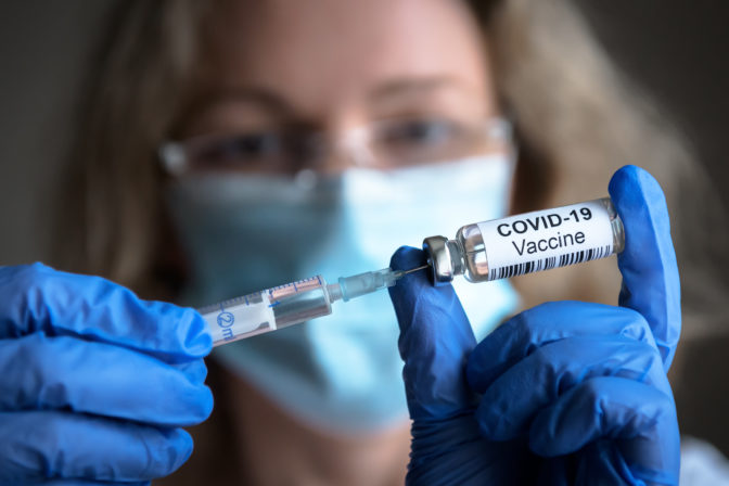 COVID 19 coronavirus vaccine in doctor hands