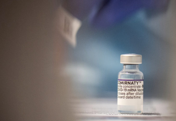 A phial of the Biontech vaccine Comirnaty stands ready at a vaccination center at the Gesellschaftshaus in Kirn, Germany, Sunday, Nov. 28, 2021. Germany has seen a spike in. COVID-19 infections.