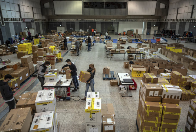 Germany Donations in kind are sorted and packed in an exhibition hall in Dortmund, Germany, Monday, March 7, 2022. The Ukraine donation campaign of the Dortmund association "Grenzenlose Waerme - Refugee Relief Work e.V." has been running since Wednesday. The Bundesliga soccer team Borussia Dortmund is supporting the campaign with packaging material, among other things. Russia Ukraine War