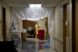 Virus Outbreak FILE - Dr. Shane Wilson stands inside a section of Scotland County Hospital set up to treat COVID 19 patients Tuesday, Nov. 24, 2020, in Memphis, Mo. As of Monday, Feb. 14, 2022, health care workers in 24 states, all but three of whom voted for former President Donald Trump in 2020, will be required to have received their first vaccine dose or an exemption. At the hospital about 25% of the 145 employees remain unvaccinated and 30 of them have been granted exemptions.