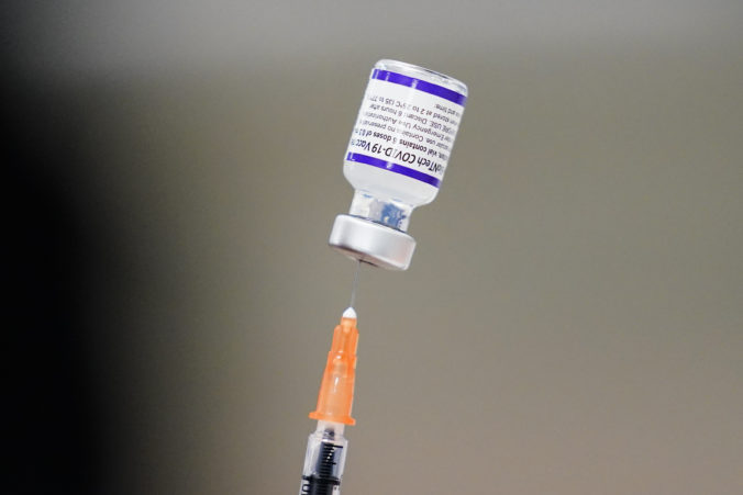 Virus Outbreak FILE - A syringe is prepared with the Pfizer COVID 19 vaccine at a vaccination clinic at the Keystone First Wellness Center in Chester, Pa., on Dec. 15, 2021. Pfizer is expected to request authorization for an additional COVID 19 booster dose for seniors. Vaccines Boosters