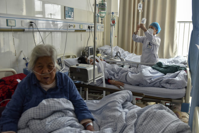 Elderly patients with COVID symptoms receive intravenous drips at the emergency ward of a hospital in Fuyang in central China's Anhui province on Jan. 4, 2023. China's healthcare authorities declined to include Pfizer's COVID-treatment drug in a national reimbursement list that would have allowed patients to get it at a cheaper price throughout the country, saying it was too expensive